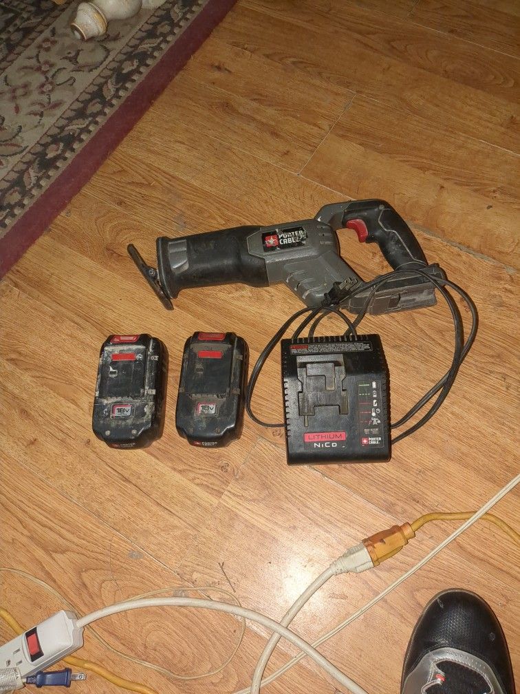 Porter Cable Sawzall 2 18v Batteries And Charger And Stream light Battery And Charger