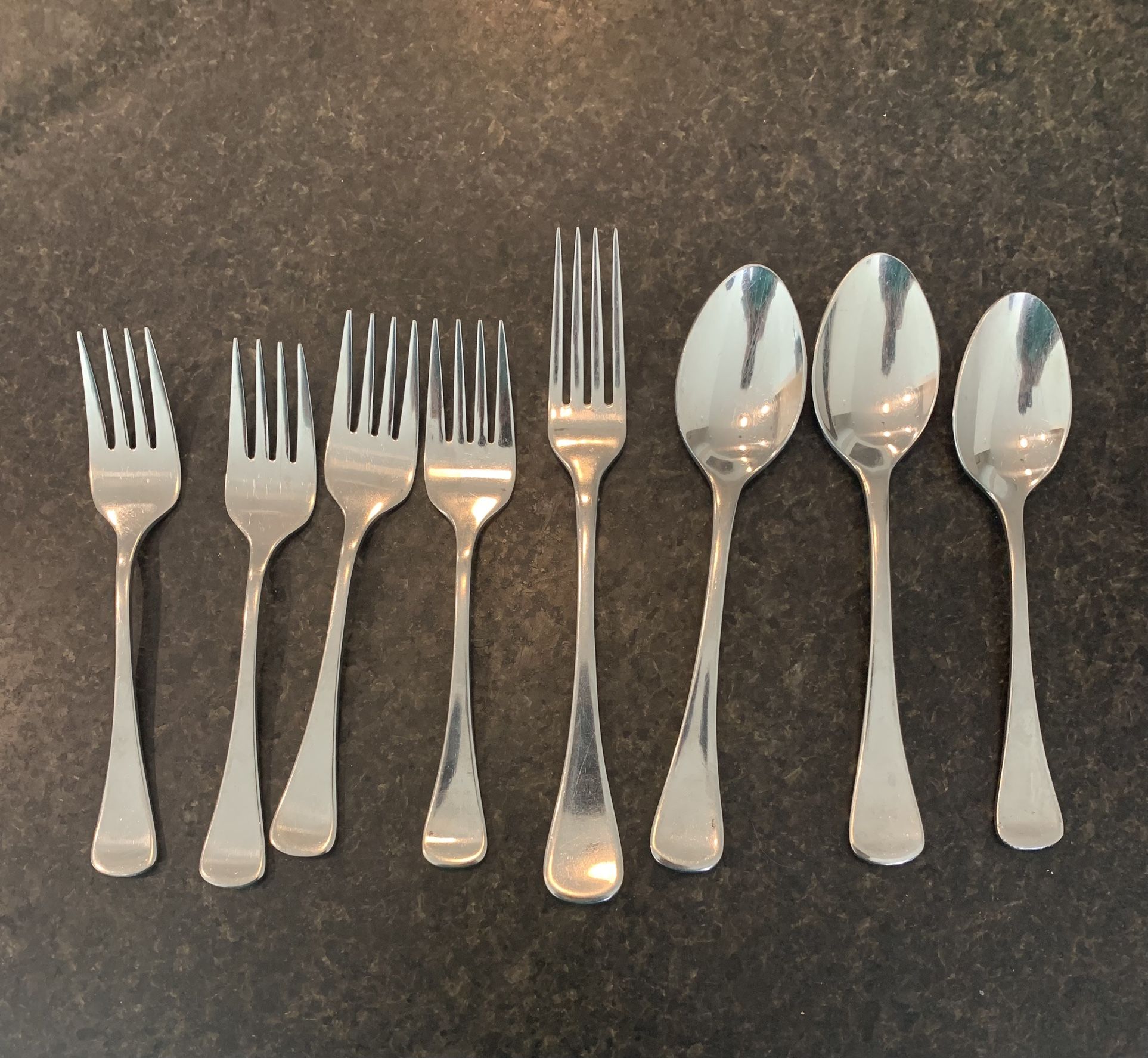 8 Pieces of Matching Silverware by H.F. LTD
