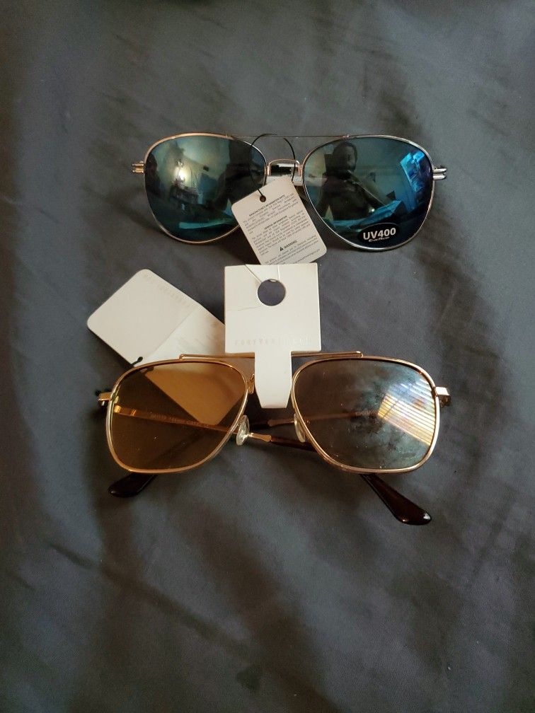 2 Pairs Of Sunglasses