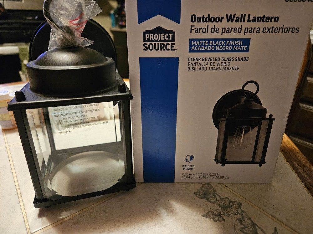 Outdoor wall lantern, matte black finish, clear beveled glass shade