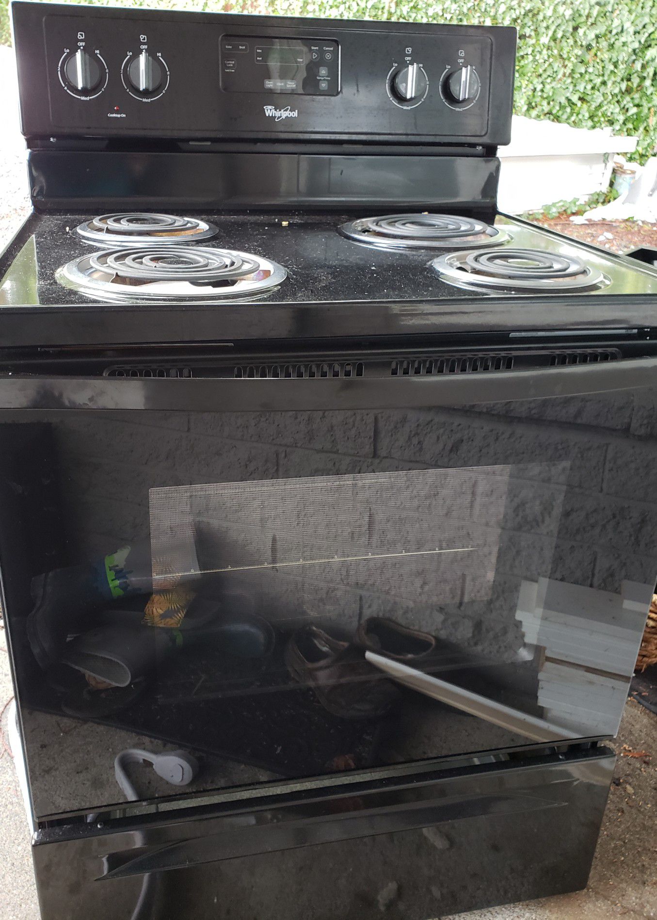 Whirlpool black electric stove oven & range. Used less than 6 months.