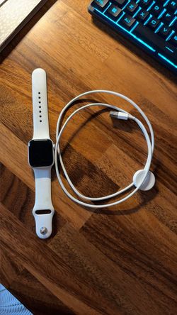 Apple Watch Series 5 with charging cord