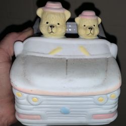 vintage ceramic nursery planter featuring two teddy bears driving a convertible car. It is an unbranded mid-century collectible 