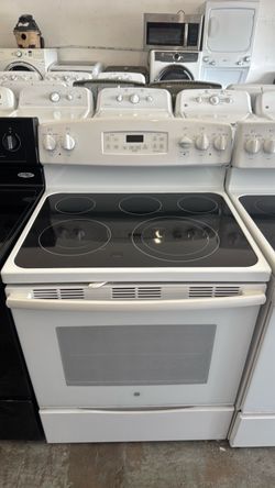 White GE glass top stove