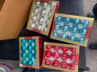 Four boxes of vintage christmas ornaments by Corning