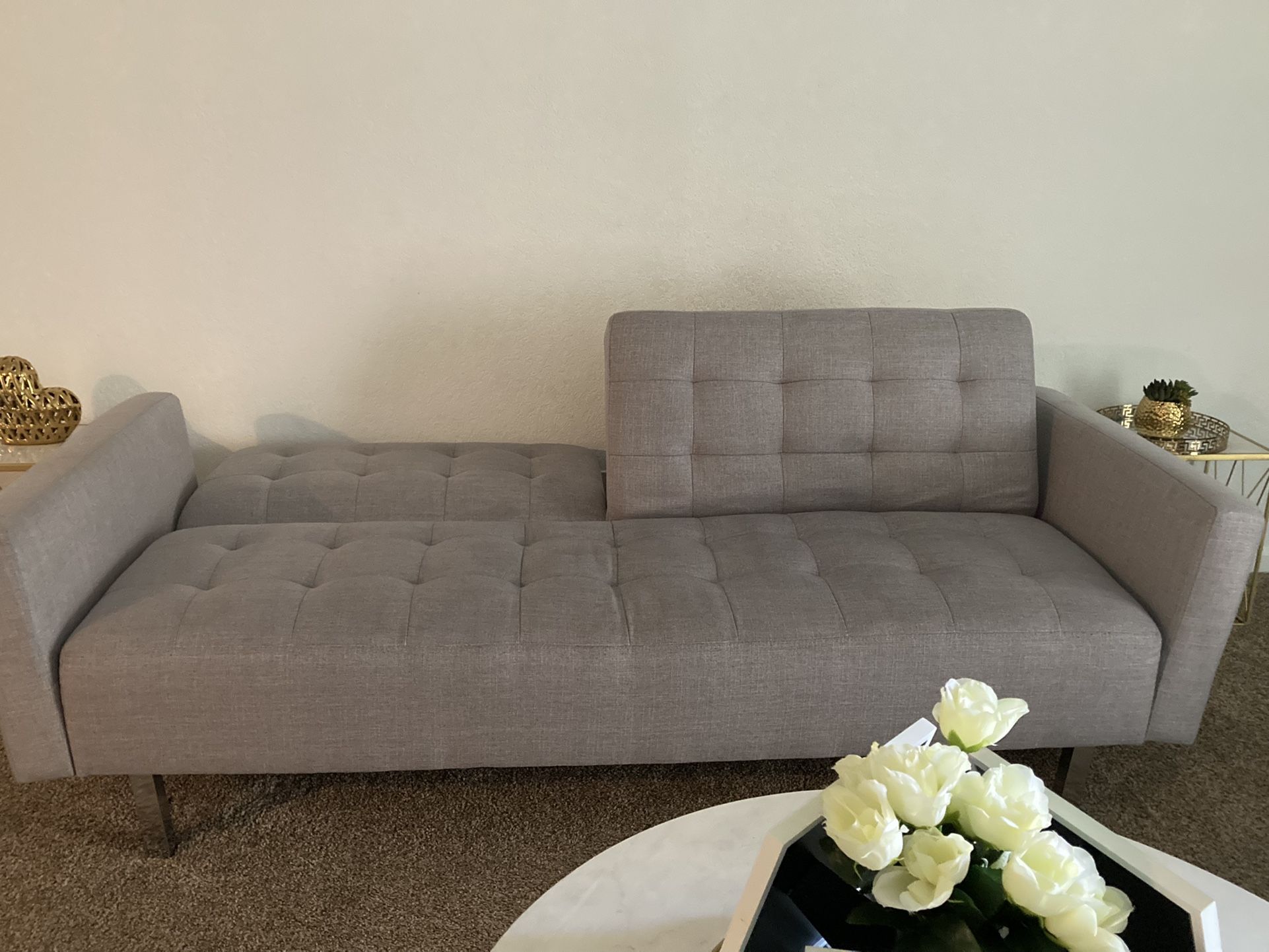 Modern futon couch 80Wx32Dx32H. It’s a 3 seater.