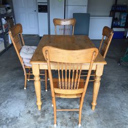 Oak Dinette Set.  Still In Good Shape but the cane bottom In 2 chairs Needs Thx. 