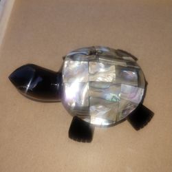 Black obsidian stone and inlaid mother of pearl