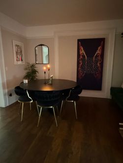 59” Black Round Table and 6 Black Velvet Chairs with Gold Legs.
