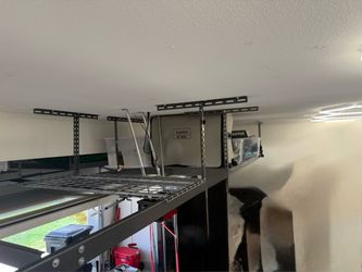 Garage ceiling mounted storage racks