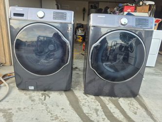 Dark stainless Samsung washer and gas dryer set