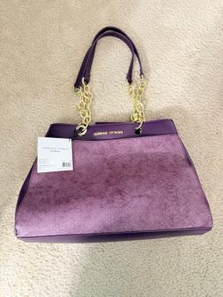 beautiful brand new women's bag. the top golden rings near logo are loose. (easy glue fix) (hurry before it's gone!)