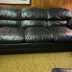 Hancock and Moore - Sofa with matching ottoman in Black leather. both on wheels