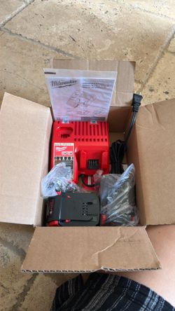 Milwaukee charger and 2 batteries