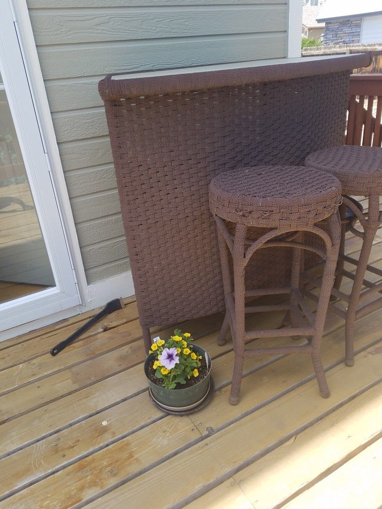 Bar Table With Glass Top And Glass Shelves And Two Chairs