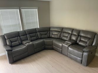 Grey Leather Sectional with 2 Reclining Seats and 2 Storage Consoles with cup holders