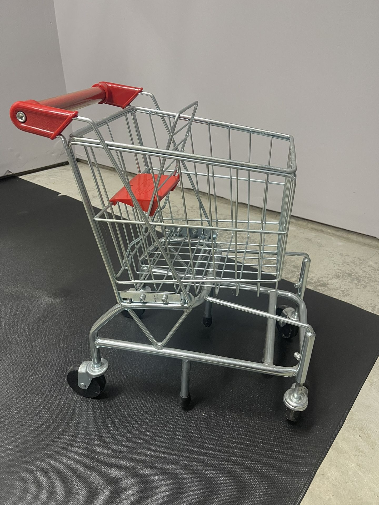 Melissa and Doug play shopping cart