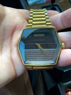 Nixon Gold-Tone Watch with Black Dial