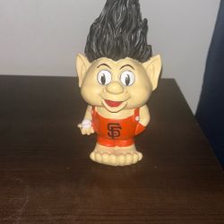Troll-style figure with The SF Giants logo.
