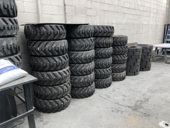 Brand new rim and tire caterpillar skidsteers