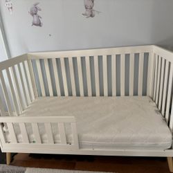 Delta Essex 4-in-1 Convertible Crib — Bianca White + Natural Legs