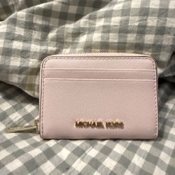 pink michael kors wallet with gold detailing and zipper coin pouch