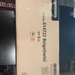 Bed Frame twin in box never used.