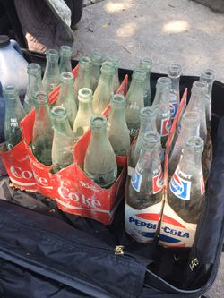Glass Coke and Pepsi bottles