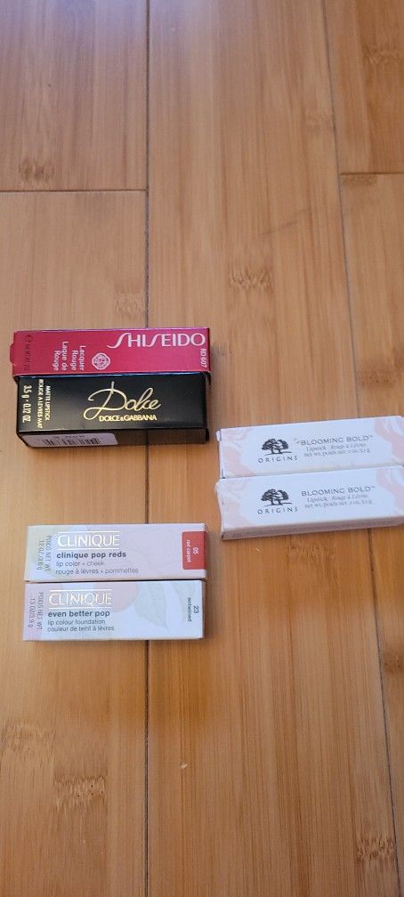 Brand New 2 Clinique and 2 Origins blooming bold and 1 Dolce and 1 Shiseido lip gloss all $45