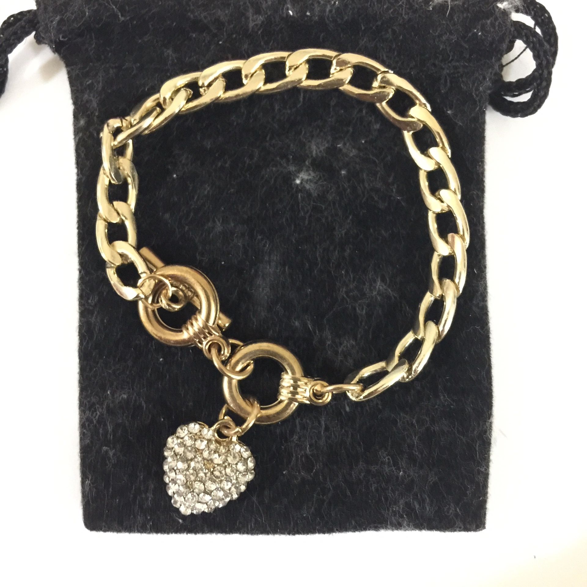 Gold tone charm plastic bracelet