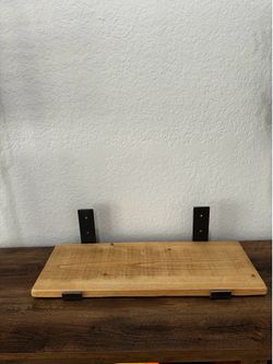 Wooden shelf with metal handles