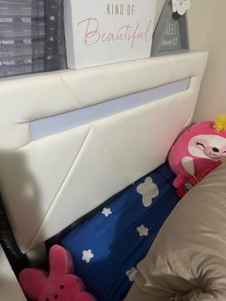 Twin bed with lights in headboard and mattress