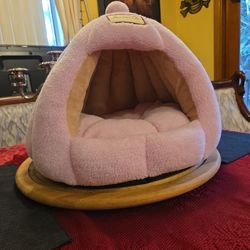 Cozy pink cat bed.