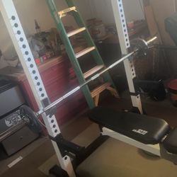 Weight Bench and Squat Rack With Barbell And 300 Pounds 