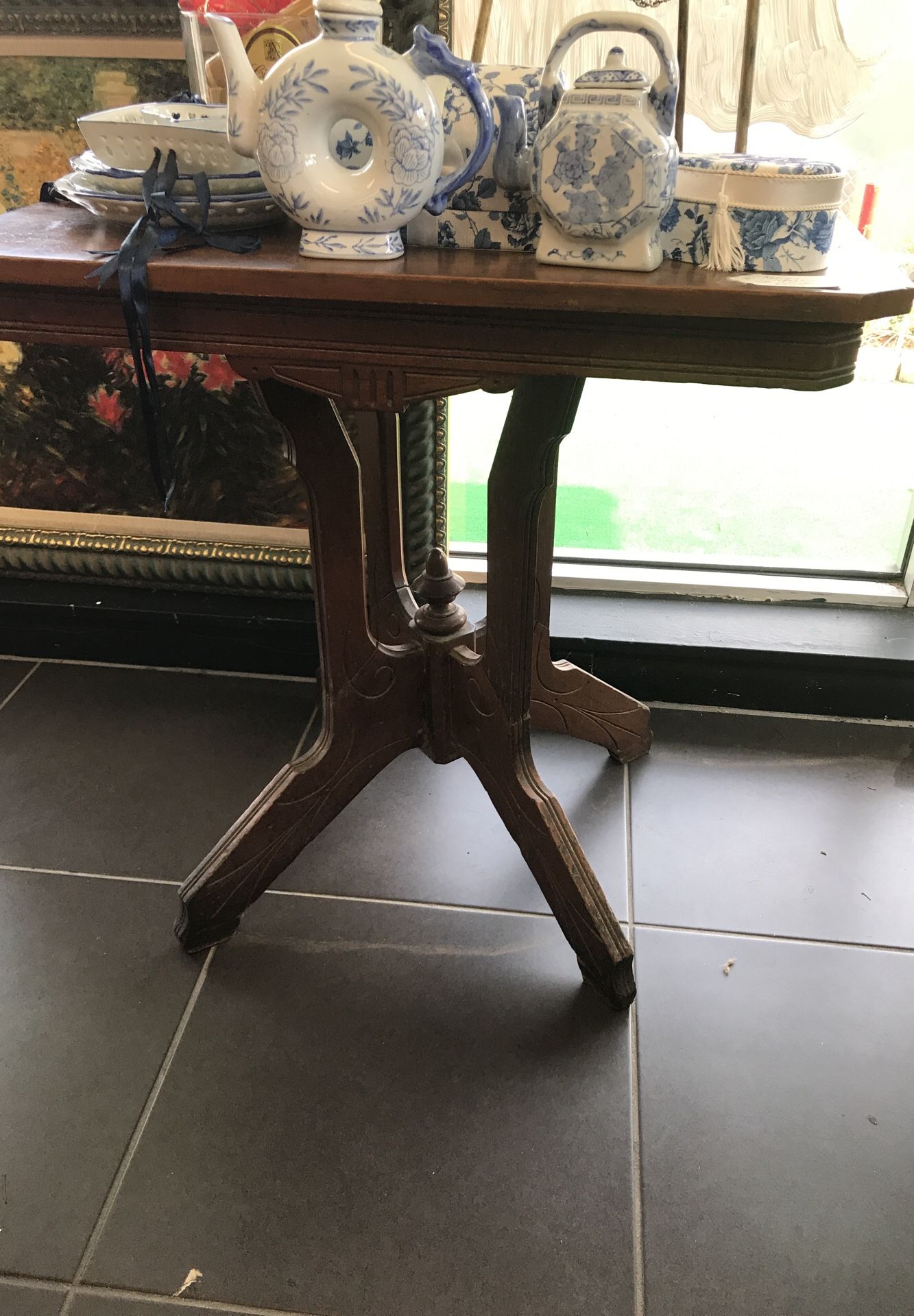 Antique side table purchased from the Colonade Restaurant.