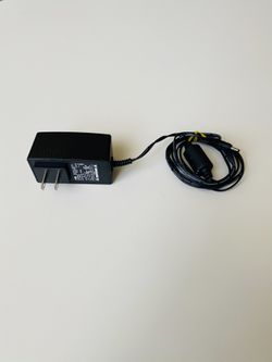 AcBel Switching Adapter. Technicolor. DCI105COM. Model: WA9003. Input: 100-120V. 50-60Hz. Max 0.2A. Output: 5V. 1.5A. New. Never used.