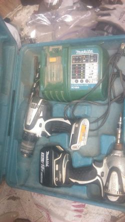 Makita drill and Makita impact 18 volts with charger and case