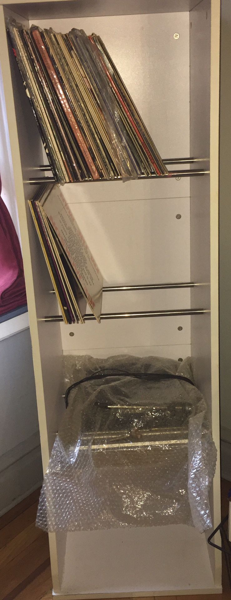Record album holder or get creative and make it a child’s wardrobe