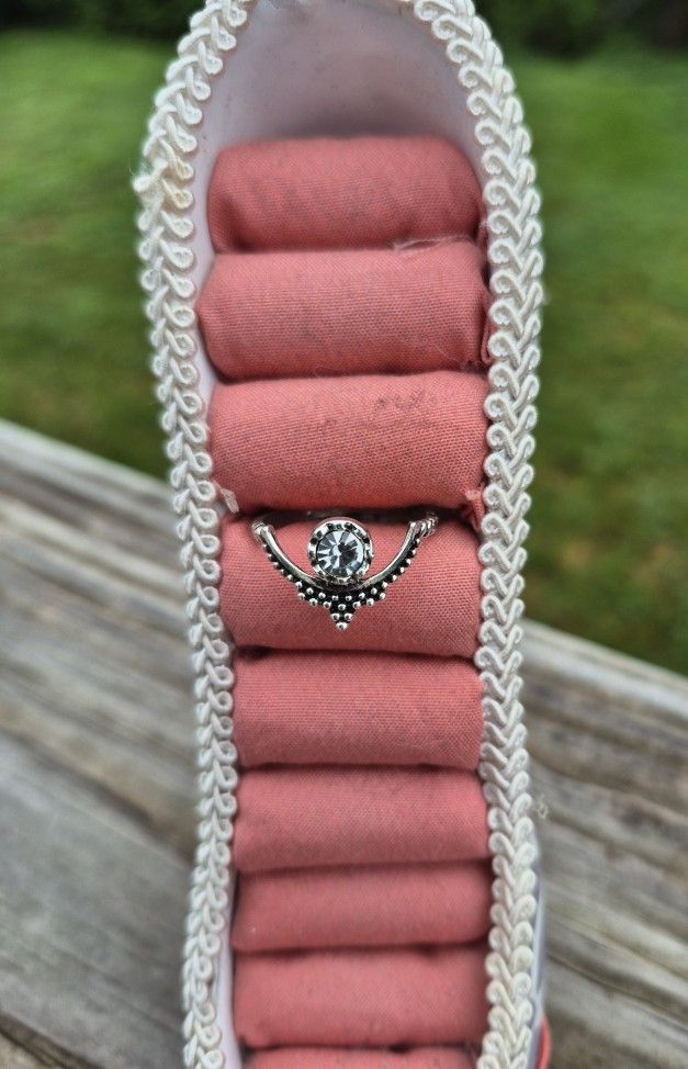Pretty Silver Toned Ring with crystal in the center. Size 8