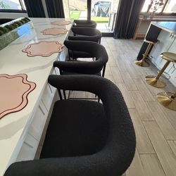 Four black Boucle counter height chairs