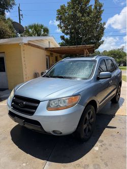 HAVE A NICE 09 Hyundai Santa Fe SUV has ice cold AC good tires, good brakes, nice aftermarket Bluetooth stereo touchscreen. This car has a V6 engine, 