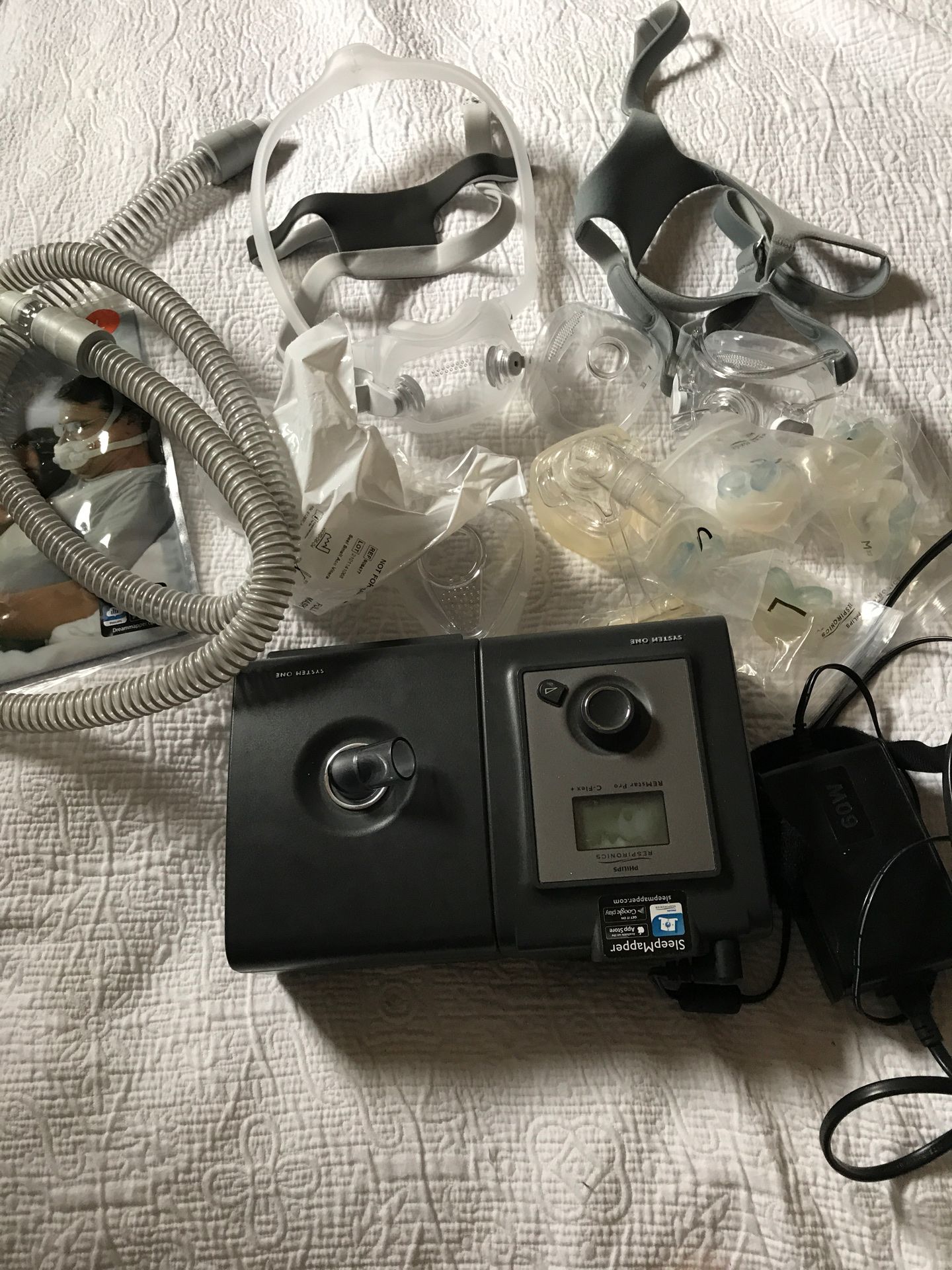 Philips Respironics CPAP machine with hose and two new face masks complete with headgear. Also have nasal cushions type .