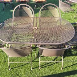 Patio Table And 6 Heavy Duty  Rocking Chairs 