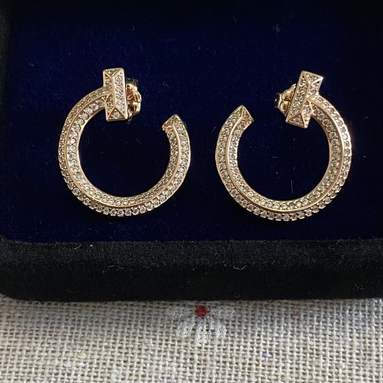 Tiffany 18K diamond round earrings