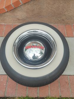 Gmc/Chevy 10 lug pattern wheel with new tires and Chevy caps