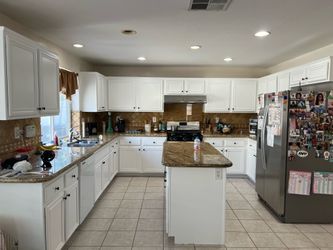 Kitchen cabinets and refinishing vinyl