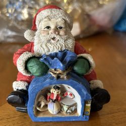 Small Santa Claus figurine. About 4”x3”