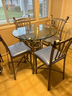 4 chairs and glass table