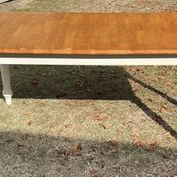 A Wooden & White Table With 4 Chairs 