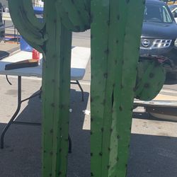 Metal Cactus And Blooming Plants